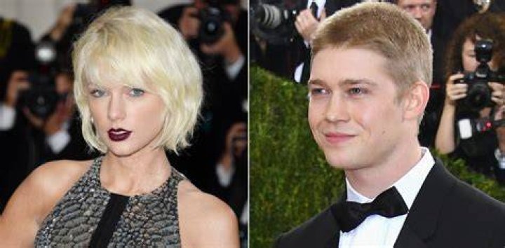 Joe Alwyn with a buzzcut, wearing a suit on the red carpet at the Met Gala