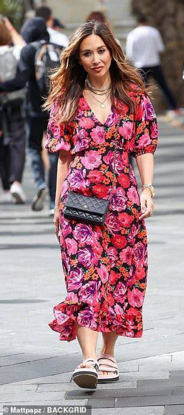 Looking good: She accessorised with several items of gold jewellery